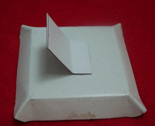 Attach cardboard to make a stand for your frame